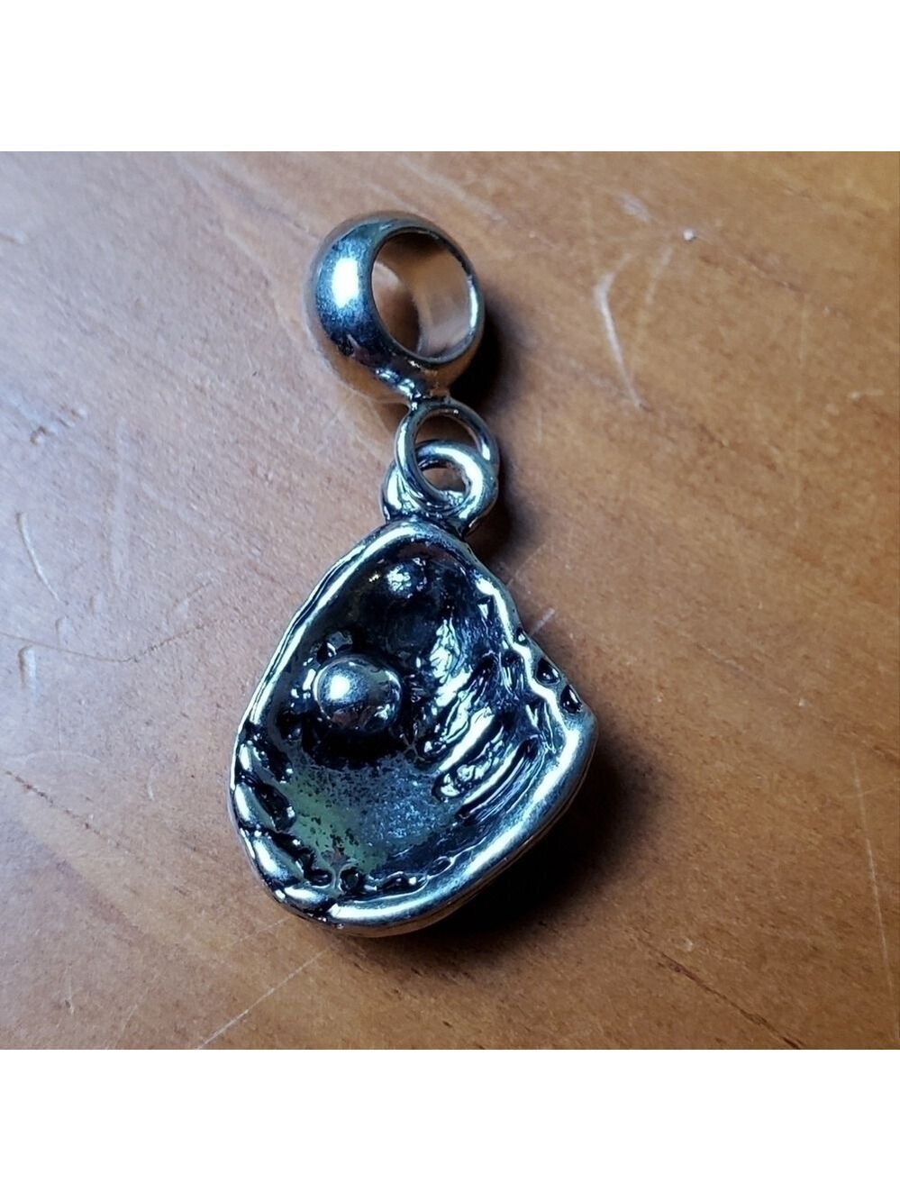 NWOT charm, silver colored half clam shell with silver pearl